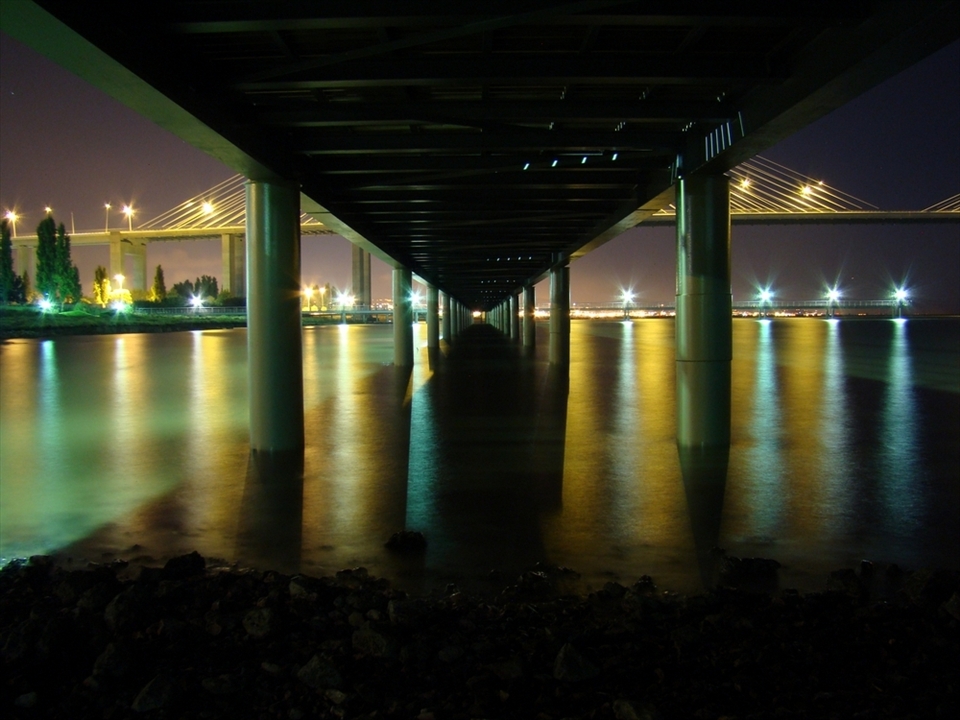 Still another view of Vasco da Gama Bridge taken from under this river Tagus passage during low tide. It was about 11pm, there was noone around and I had the place to myself to completly absorb it.