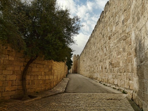 Looking back in history. One can only imagine all the history behind these stone walls, all the events that happened here, and all the people that walked this road.