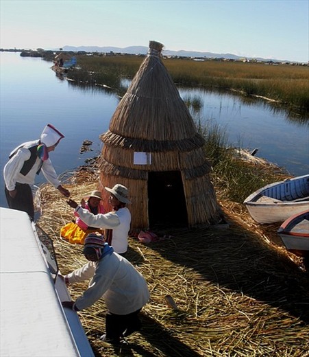 Uros Island, Lake Titicaca. Paying the entry toll