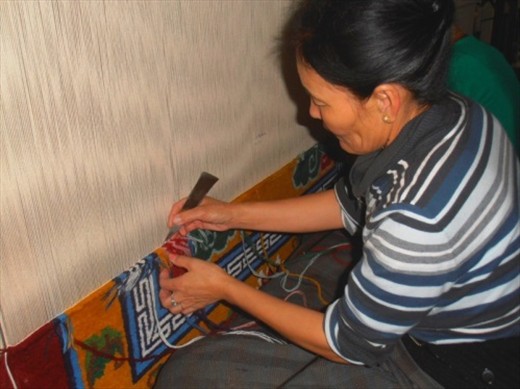 Trimming the carpet before beginning a new row