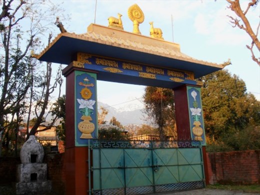The nunnery gate with the Dhauladhar mountains in the distance