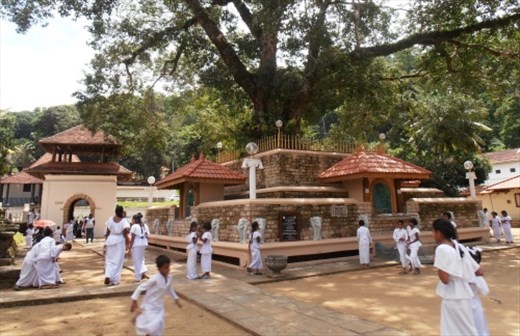 Sri Lankan Buddhists in white at Dalada Maligawa temple, Kandy