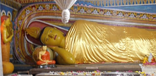 Cheery reclining Buddha at Dalada Maligawa, Kandy