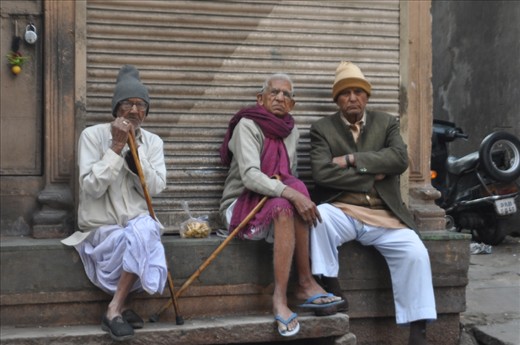 Men and their afternoon mutterings, gaze suspiciously into the camera. 