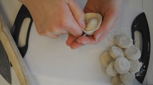 Shaping a gold nugget shaped dumpling