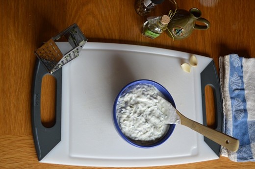 Mixing in the yogurt.