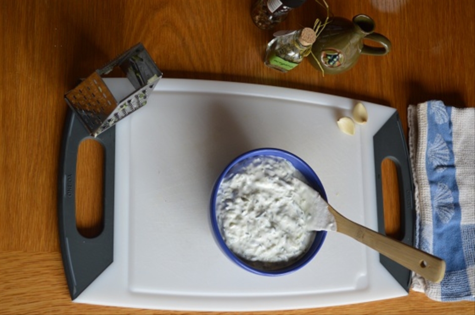 Mixing in the yogurt.