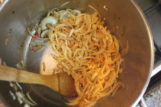 Saute the onion and chilies. Use a spatula to get the browned bits off the pot.