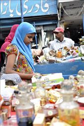  A girl engrossed in shopping for the festival of Eid: by framed_flux, Views[333]