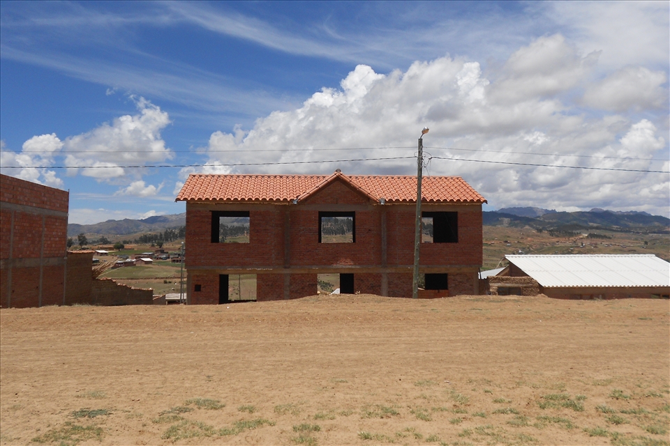 Windows on the infinite. Bolivian fields. While hiking in search of a place called 'Seven waterfalls', I stopped to look at the sky across one of the many empty houses along the road. 