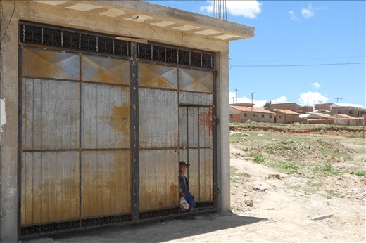 Dark eyes and bread. A boy in his neighborhood, one of Sucre's suburbs. Sucre is considered the jewel of the country, but poverty is everywhere around. The deepness of this boy's look is something I will never forget. 