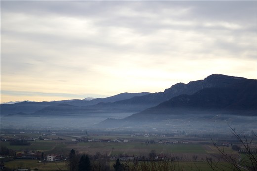 My village at sunrise , with a veil of fog that covers all the houses. Nikon D31