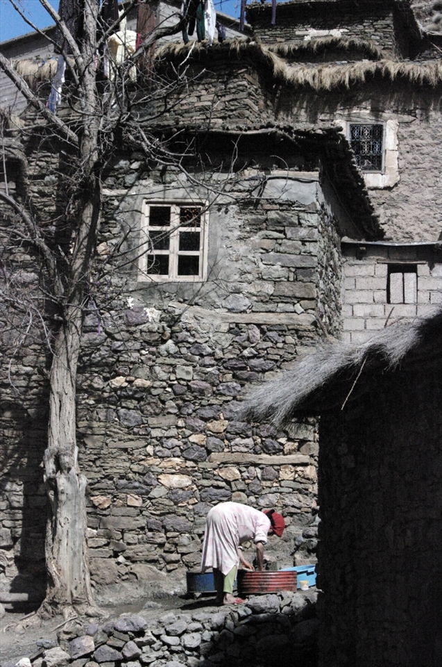 Woman washing clothes in a small village on the Atlas Mountains