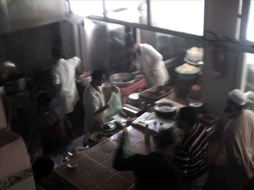 Busy workers in a small restaurant and good Tajine of Ram served all long day.