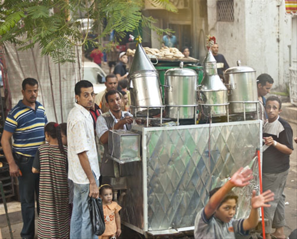 Cairo Locals: Observing western tourist bus  while preparing for Eid-ul-fitr.