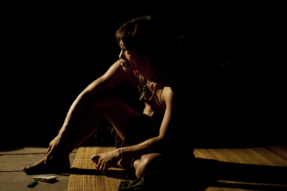 As he discusses the hardships endured by a Mentawaian couple that has attempted resettlement in a government village, the feature of Lugi, my Mentawaian guide, is illuminated by light from a gasoline lantern. His skin, however, is devoid of traditional tattoos that have adorned the bodies of his people for generations; such conspicuous body art standouts beyond the realm of the jungle, making assimilation with other Indonesians difficult. Although having being born in the jungle the majority of Lugi’s nine siblings now permanently reside on the Sumatran mainland or in modern villages on Siberut Island. 

Raised by his grandfather following the death of father, Lugi stays with friends in the largest city in the Mentawai Islands, searching for tourist to bring back to his grandfathers home in the jungle.  For Lugi, guiding tourists doesn’t simply provide a source of income to his people; the photographs and stories that tourists take away ensure that the Mentawai people and their culture will not be forgotten.