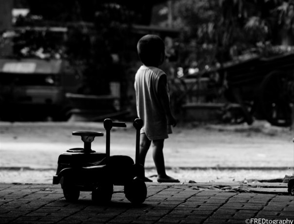 As if growing up, a kid leaves his old toy behind. 