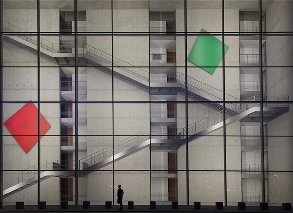 Man stands infront of a building