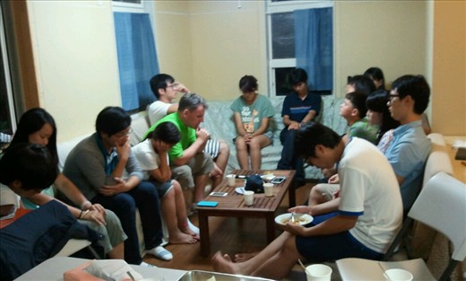 A Korean college team praying for the work we step going together.