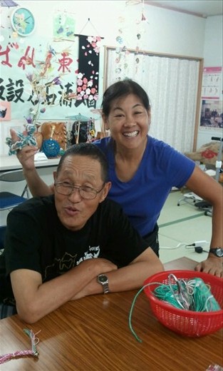 Mr. Sudan who made all these beautiful crafts, purses.and other accessories. He was s very genial Guy and showef us his kasetsu (temporary. Housing). He shared how he lost his wife in the tsunami and how Joseph recently renovated house wad totally destroyed. His home is a small area either a frightened and washer in the foyer and 3 rooms about 8x10' in size in a mobile trailer occupied by two other families.