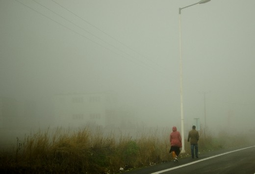 This one was taken ealier on the road, when we passed through thick fog. The landscape changed completely and became very alien and eerie, but these two people walking added a nice touch to the scenery. 