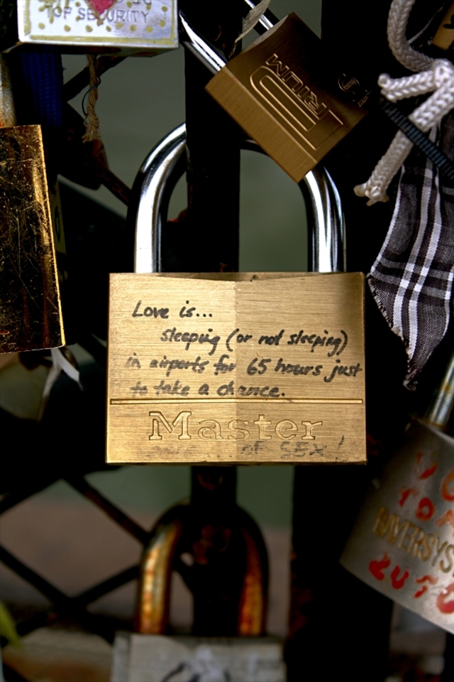 This is one of many locks found on the bridge leading to the Notre Dame in Paris. I realized that the two things written on this lock represent the dichotomy that exists in Paris: between the idealized city that is portrayed by Hollywood to outsiders and the sometimes hard reality of  actually living here. 
