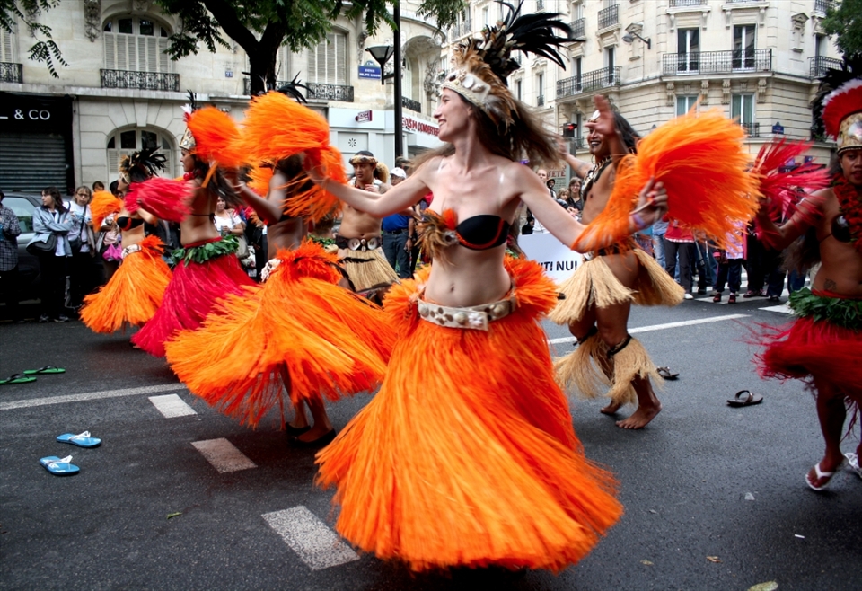 This was taken at a multicultural festival in Paris. As anyone who has been to Paris can tell you, it is often lacking in color, which is why I was so stricken by these Polynesian hula dancers. They were so vibrant in contrast to the grey of their surroundings. 
