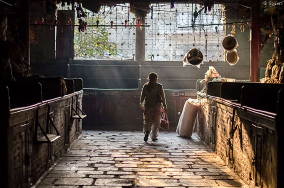 Done shopping for the day, this lady is leaving from the other gate of the market building which is more than a 100 year old.