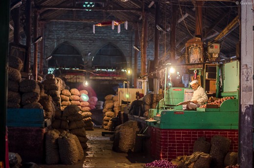 This old man is guarding his property while going through the morning news. Wonder where all the young people are..