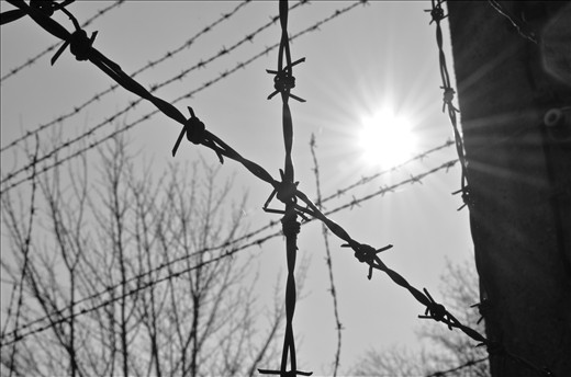 Barbed wire spanned the boundaries 