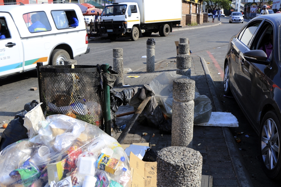 Vusi is relaxing with his head cushioned next to red line. A car accident made him more than an amputee,he became a traumatized soul and a trash at the Nelspruit CBD, no wonder garbage trucks always leave him behind. The diverging lanes shows his life falling apart, with him stuck in the midst of his lifetime which has been ever since surrounded by cars.