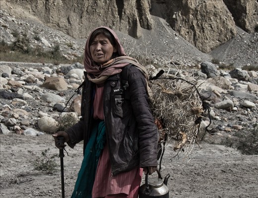 Women and men share the work equally, focusing on survival over set roles.