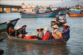 Woke up at 4:30am to visit a local fish market in Nha Trang, situated on a small sand bar on the Cai River to capture the hustle and bustle of the morning activities.  Morning sun breaking on a shore boat transferring the catch to the waiting buyers.: by george2georgiou, Views[683]