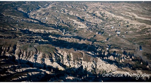 balloons like flies in the air to the cravasses of the ground