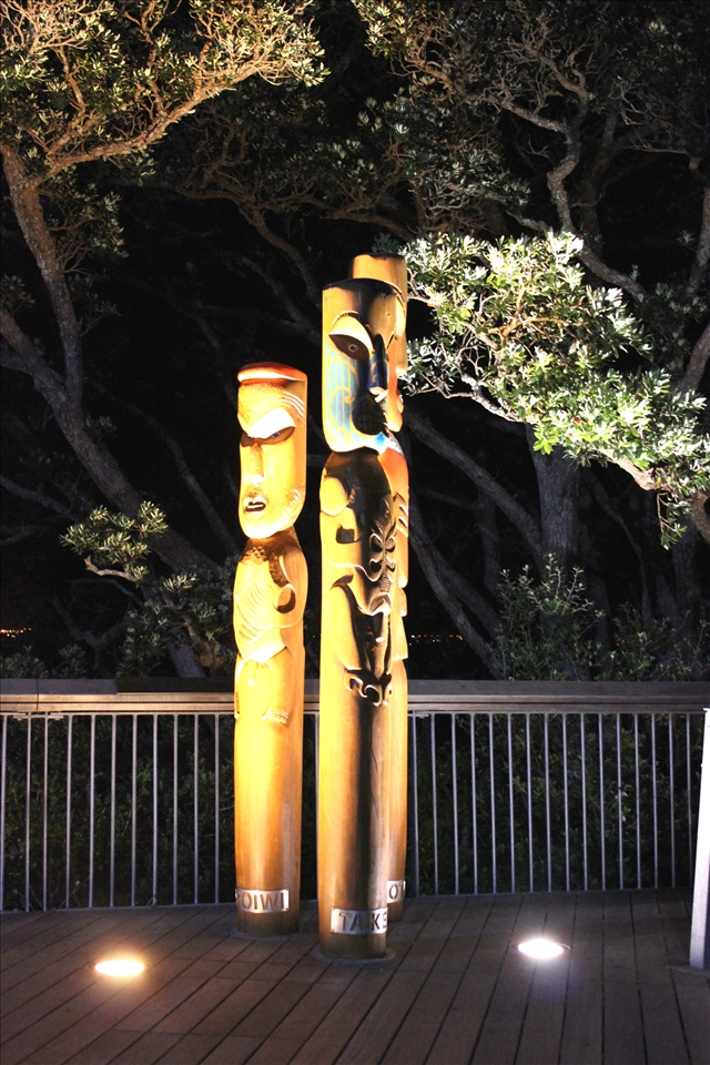 Maori statues in Mission bay at midnight. Auckland.