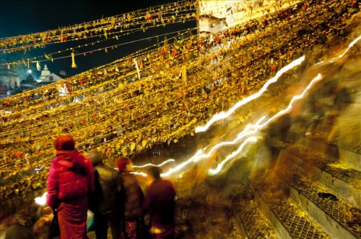 People light traditional oil lamp (diyo) and recite mantras. They keep awake all night to ensure that the lamp keeps burning. After walking inside the temple throwing 7 different kind of sacred seeds, devotees walk to the river Bagmati where the oil candles are released