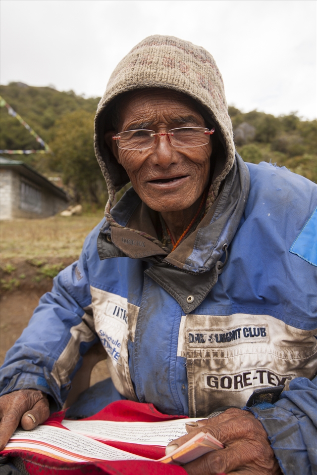 Each wrinkle signifies a stone laid. A prayer reading, sun-kissed Nepalese laborer sits in his donated plastic chair on the high trail out of Namche Bazzar. Living only off small donations from passing trekkers, he dedicates his life to laying stone with his bare hands, in order to keep the trail accessible throughout the year. His efforts have literally paved the way for thousands of locals and tourists for years, whilst keeping the trail clean from waste and erosion. Not understanding much Nepalese besides ‘Nameste’, I make a donation to in his weathered timber box, sign his 'travel diary' and we exchange handshakes. 