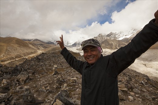 Not much grows up here, except memories.
Sherpa Prem stands at the top of a glacier ridge where only the faint cracks of slow moving ice can be heard. “Not much grows up here, but memories’, he says softly in broken English, supported by a humble smile. His dream one day is to travel to Australia for the first time to discover the outback, but saving money in Nepal takes many years. Getting excited he gestures the ‘peace’ signs as a symbol of how he feels, as its only days before his three-month work stint comes to an end, allowing him to return home to see his family. 