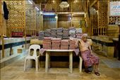 After a long day of tending to clients in the Al Nahaseen Hammam inside the souk, this gentleman relaxes next to a pile of clean towels. Today, news photos show the hammam being used as a rebel base.: by ghaddad, Views[1819]