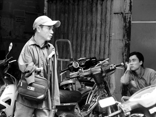 A guy - without arms - is selling lottery tickets on the street