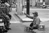 A guy - without legs - is selling lottery tickets on the street: by giaogiao, Views[588]