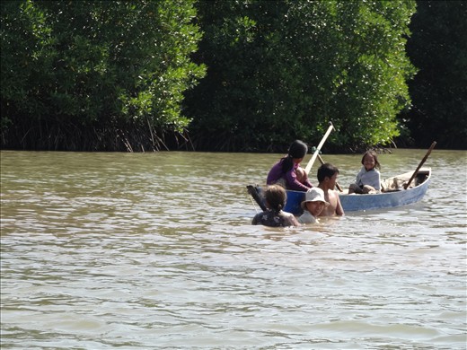 Family having a bath or swim in the river - seemed happy anyhow