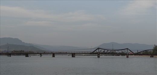 The old bridge. Still used by light vehicles. Has been repaired numerous ways
