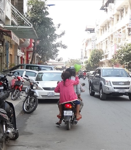 Middle passenger with IV drip on way home from hospital - held by last passenger