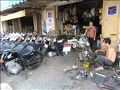 Shop and repair service on the footpath - no wonder I can't walk on them: by gina_holley, Views[354]
