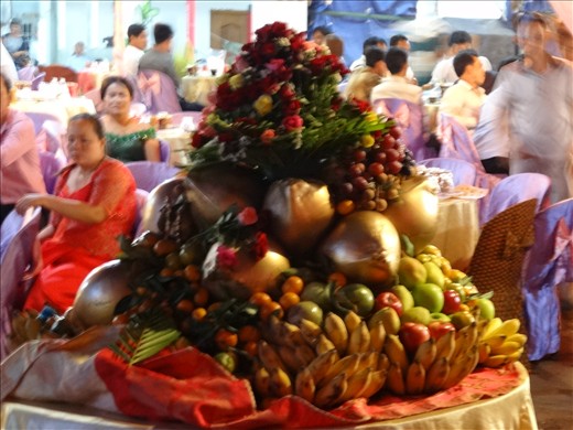 Table centrepiece at the wedding - young lads were taking fruit from it
