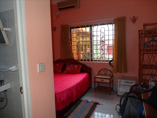 My room at Learn4Life. The bedspread got too much and is now a green market one