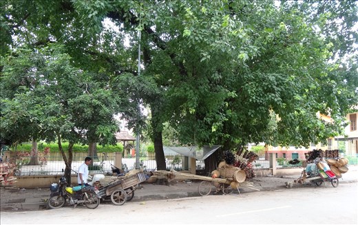 Travelling salesmen having a mid-day nap in the shade