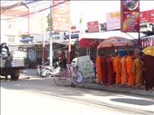Monks line up for their morning collection from shops etc.: by gina_holley, Views[310]