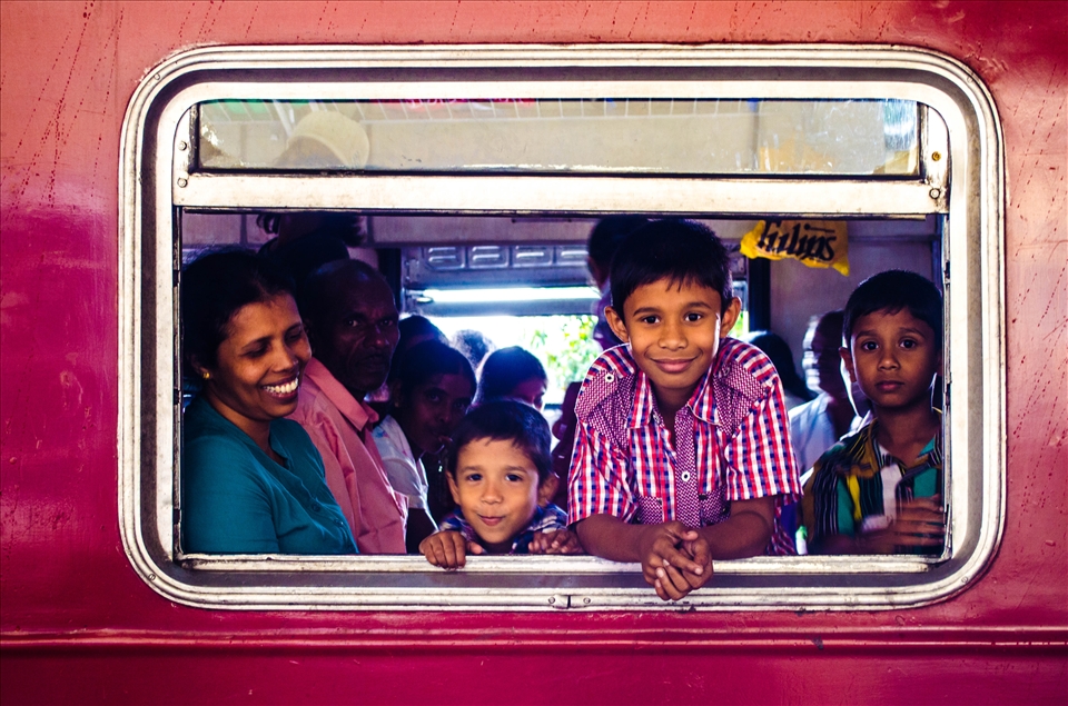 Inside a bogey - a mother watches her three children pose for the camera 